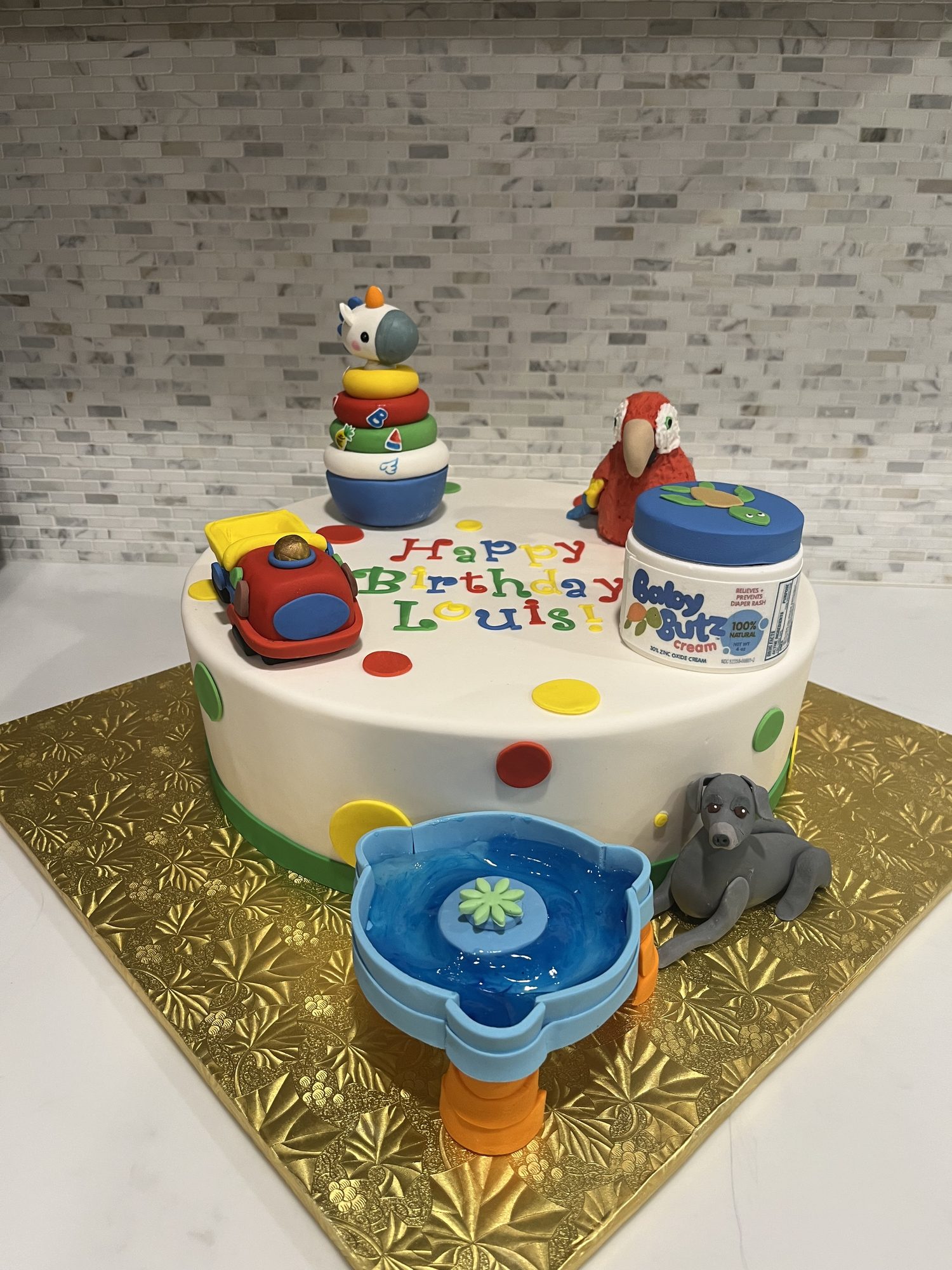 First birthday cake with sculpted baby toys